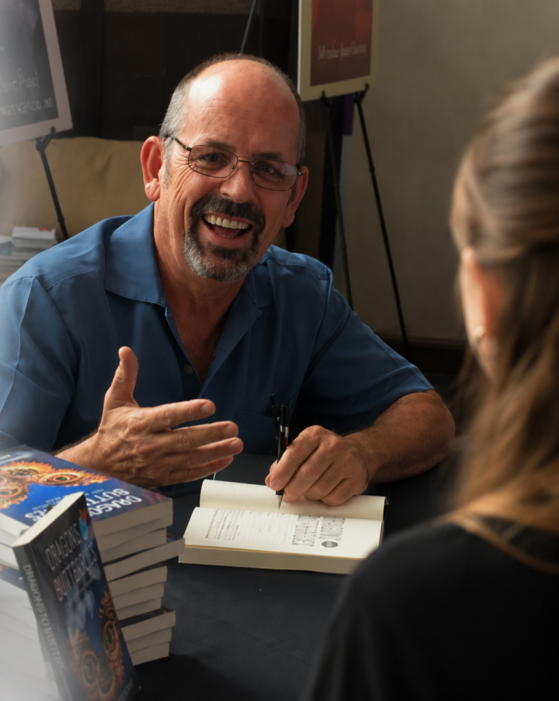 Author Johnnie Calloway signing a book for a reader.